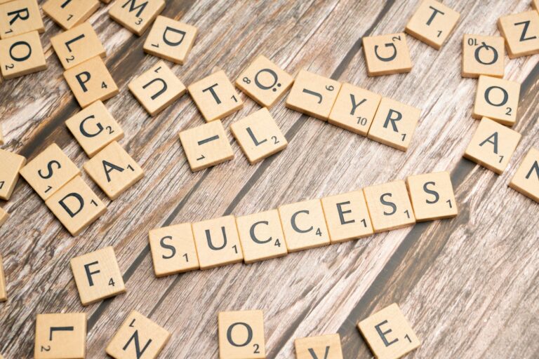 scrabble tiles spelling out the word success